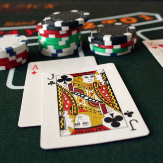 A close up image of a winning Blackjack hand at a casino table.