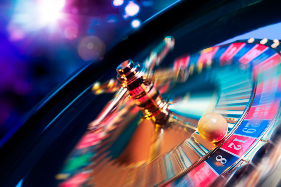 high contrast image of casino roulette in motion